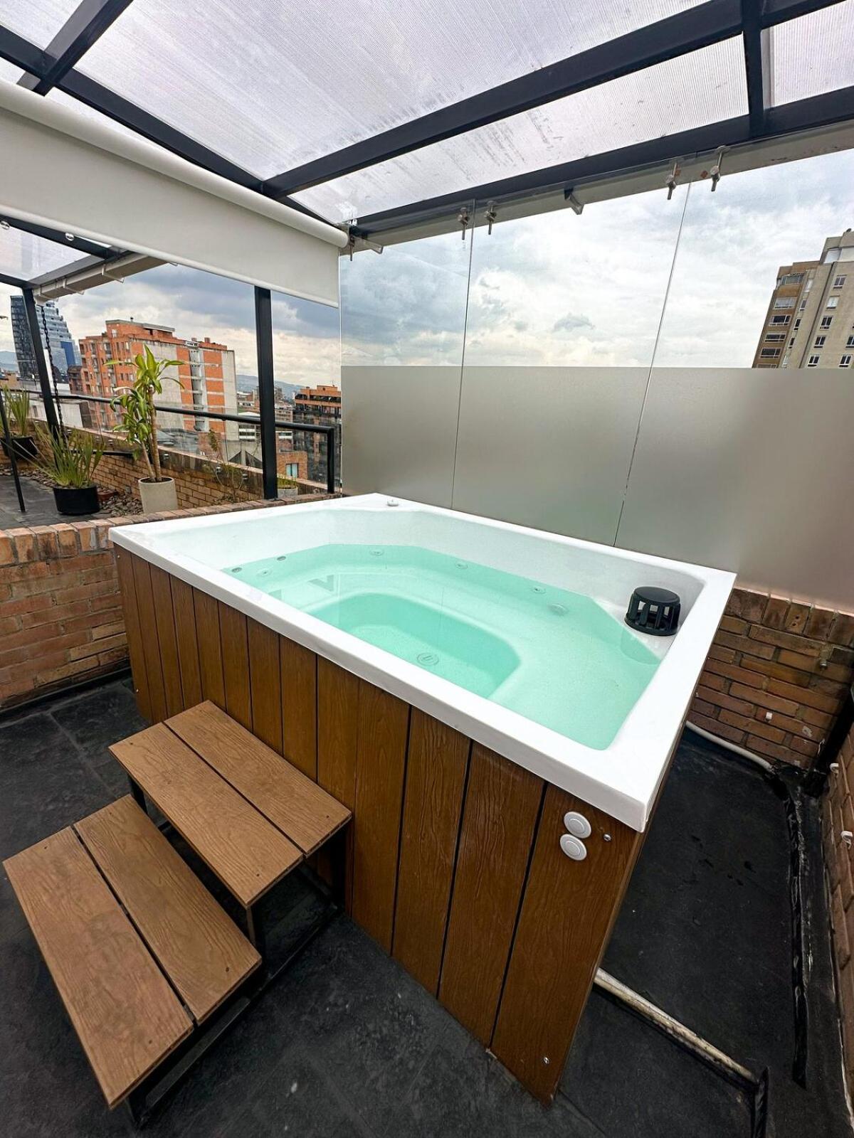 A Penthouse With A Luxury Jacuzzi And Panoramic View